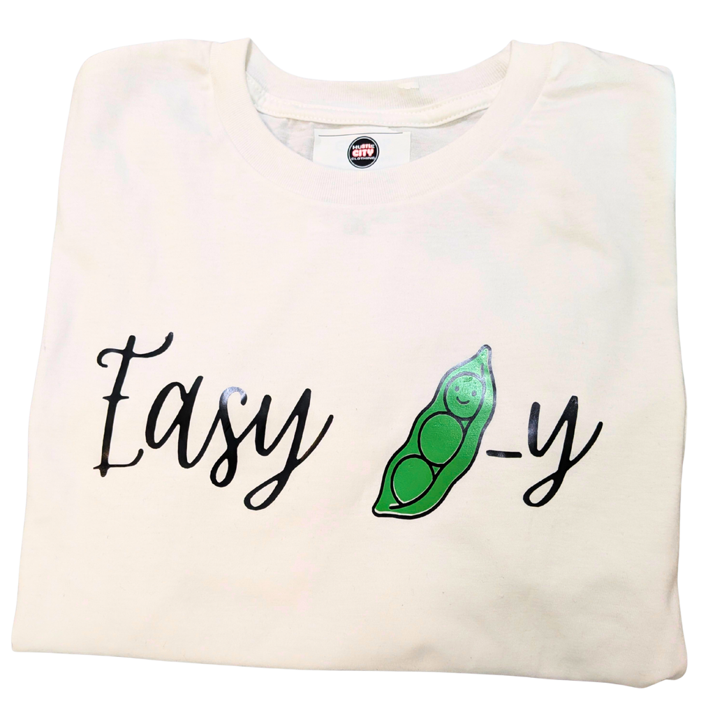 Folded white sweatshirt with 'Easy-y' text and green graphic on a white background