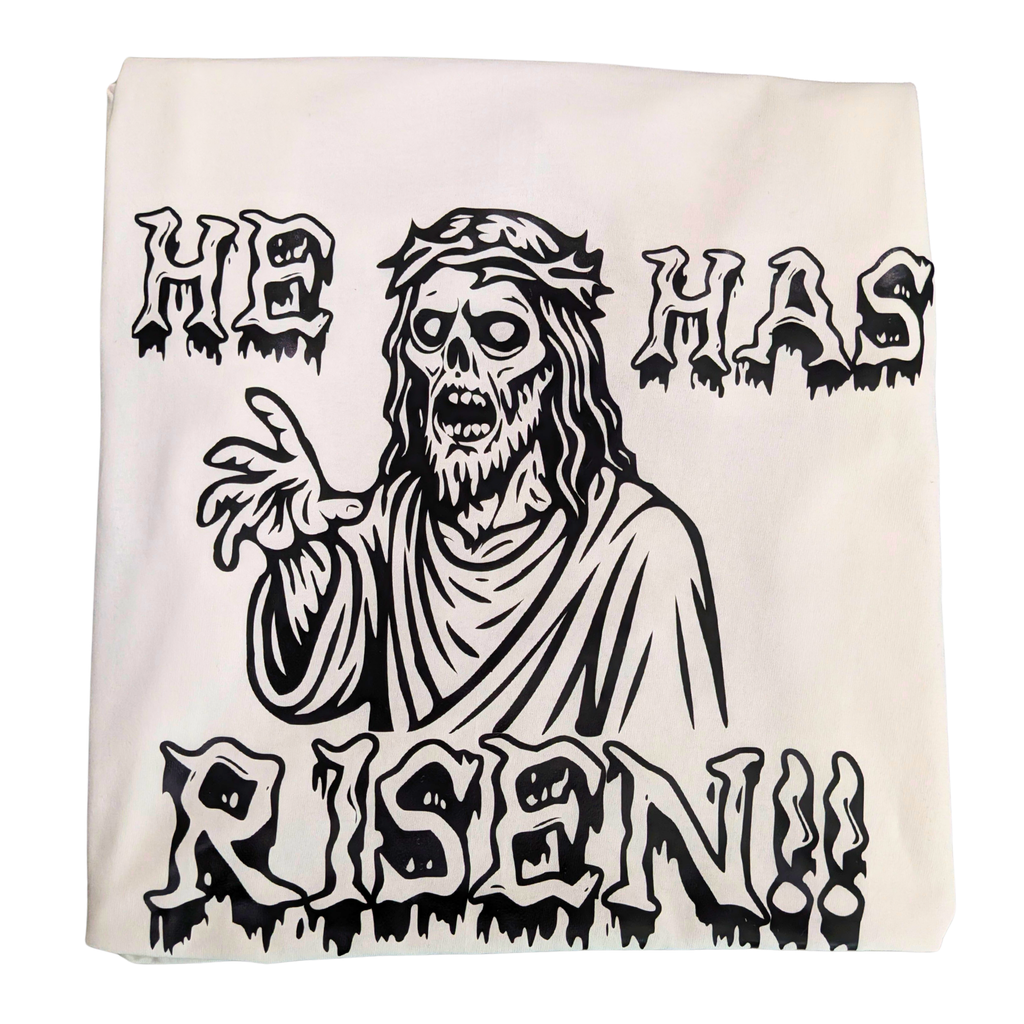 White t-shirt with a black and white graphic of a resurrected Jesus基督 and 'He Has Risen!!' text.