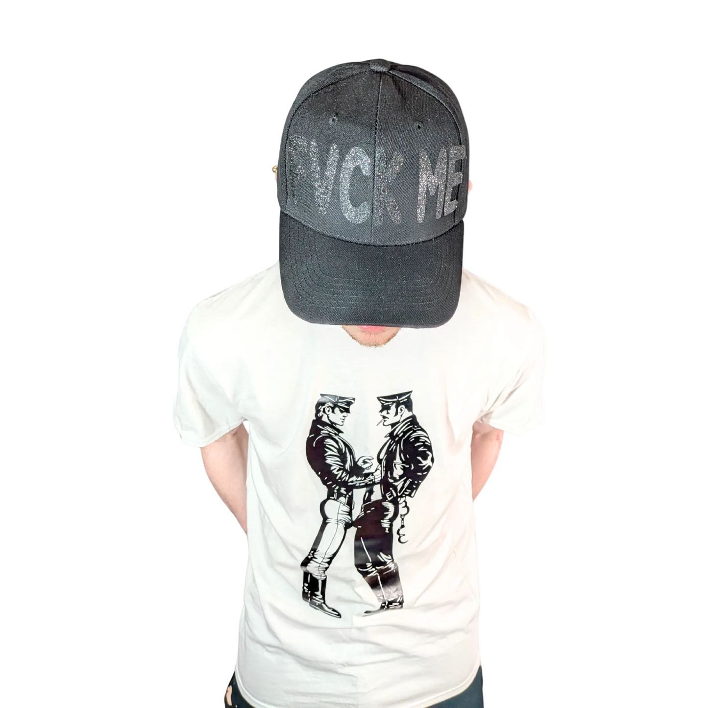 Person wearing a white t-shirt with graphic design and a dark cap with text on a white background