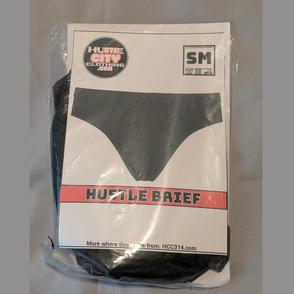 Packaged Hustle Brief sample sale underwear in Basic Black and Buffalo Plaid, size Small