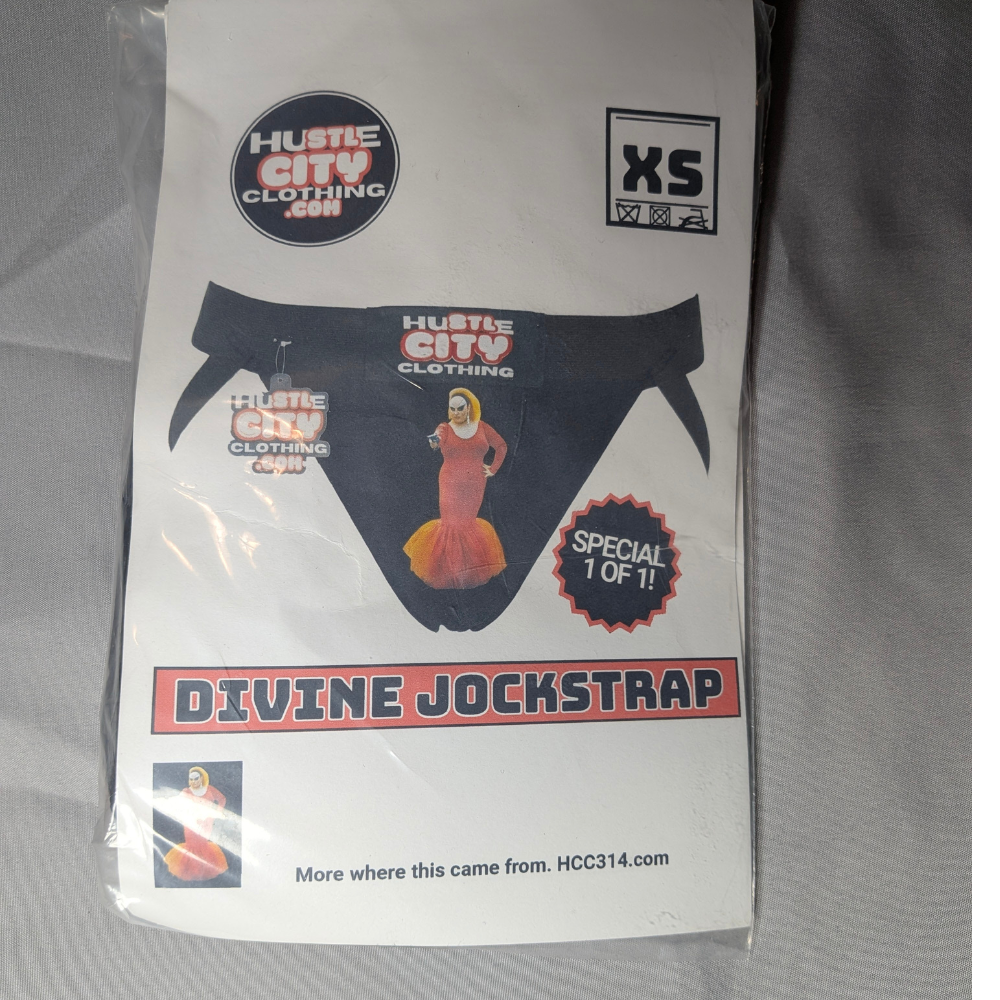 Packaged Divine Jockstrap with Hustle City Clothing branding on a gray background