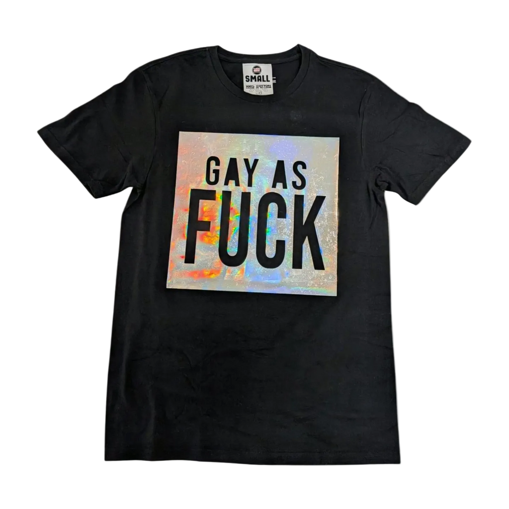 Black t-shirt with colorful 'GAY AS FUCK' text on a white background