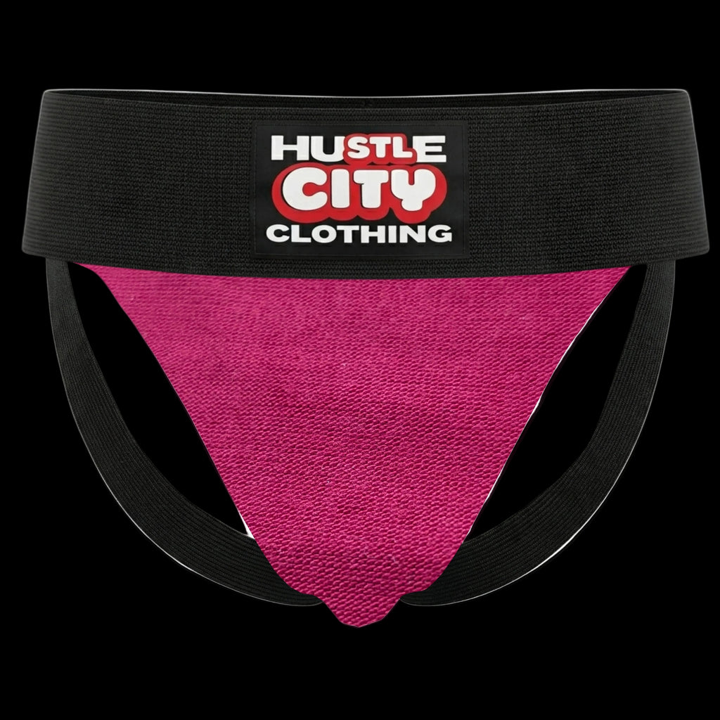 Pink athletic supporter with black waistband featuring 'Hustle City Clothing' logo on a white background